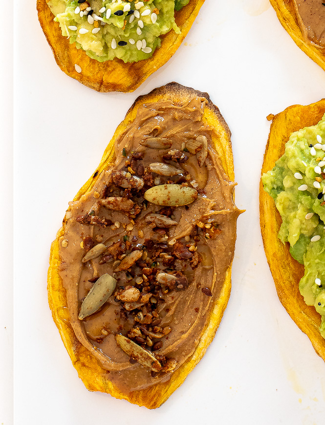 toast with peanut butter and granola on top.