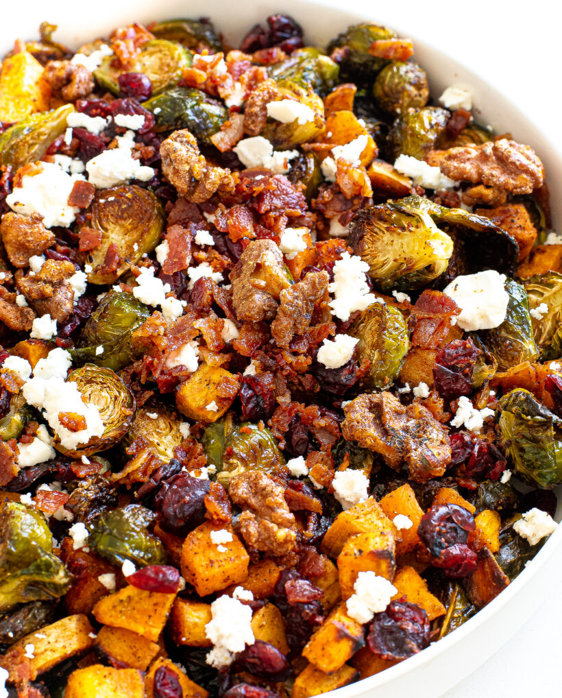 Brussels sprouts and sweet potatoes in a serving bowl.