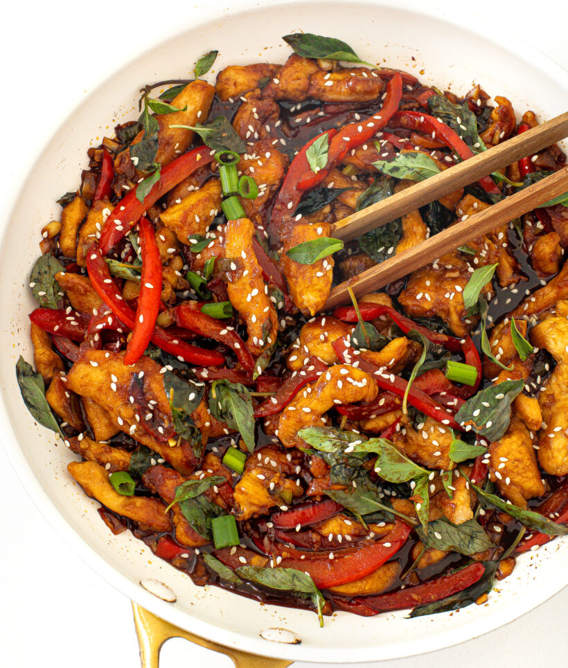 overhead shot of thai basil chicken stir fry in large skillet