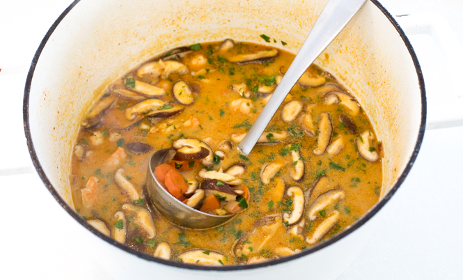 thai coconut soup finished in large pot with cilantro