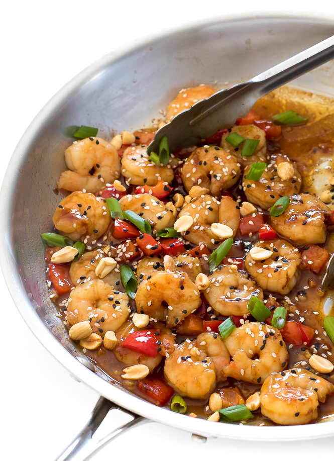 Kung Pao Shrimp | chefsavvy.com Kung Pao shrimp in skillet topped with sesame seeds and green onions.