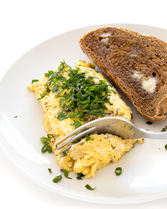 scrambled eggs sprinkled with tons of fresh herbs