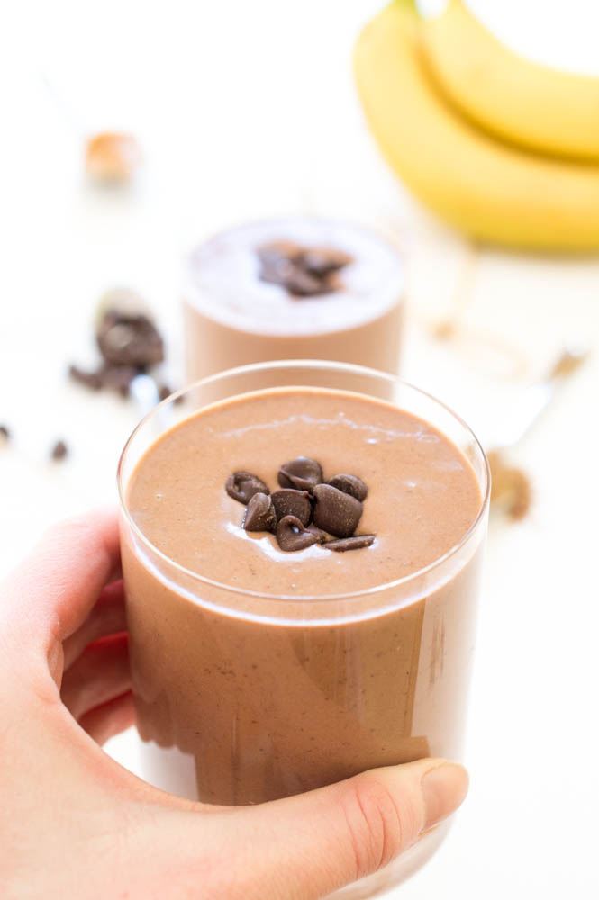 Healthy Breakfast Smoothie Recipe in a glass topped with chocolate chips. 