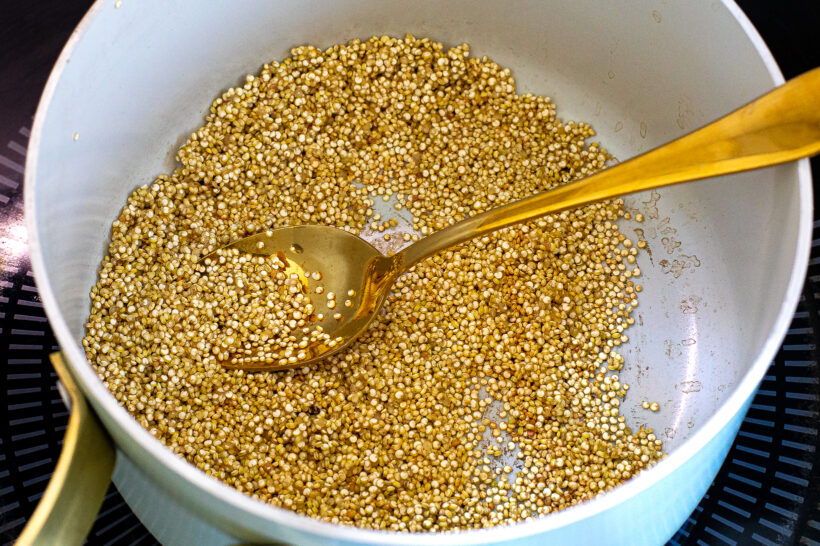 Quinoa toasting in a pot.