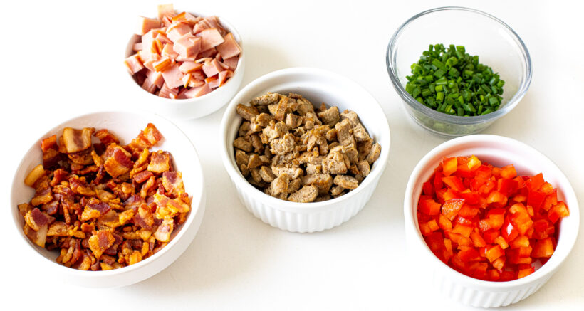 Add ins for breakfast biscuits in white bowls.