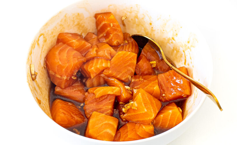 Salmon in the marinade after being stirred. 