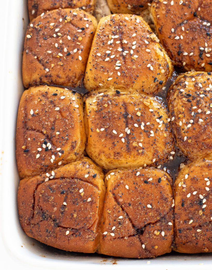 Overhead shot of turkey cheese sliders while still in a baking dish.