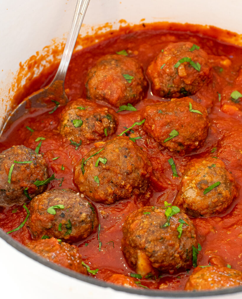 turkey pesto meatballs and tomato sauce topped with fresh basil