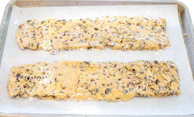 shaping biscotti into logs and placing on baking sheet