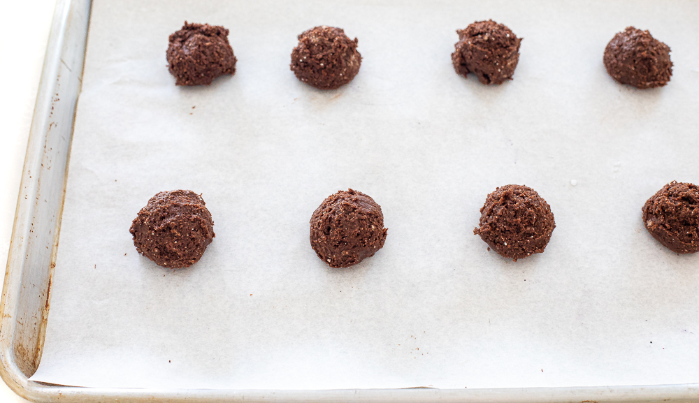 unbaked chocolate cookies on baking sheet