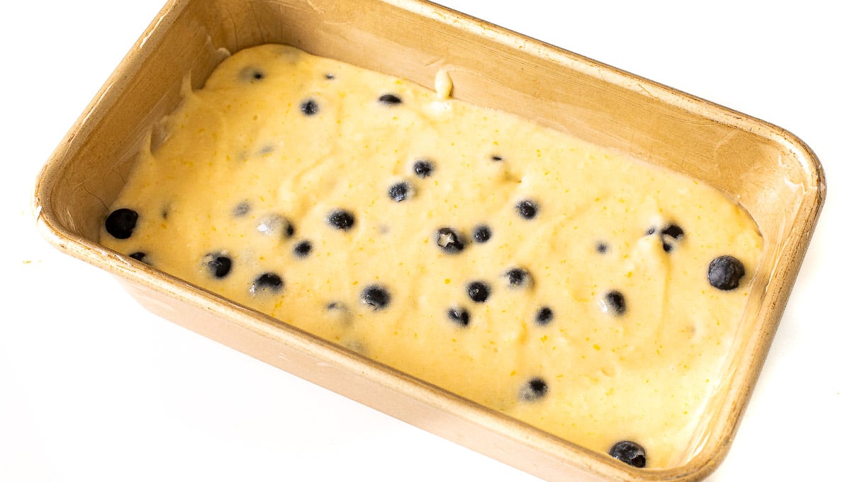 unbaked blueberry lemon loaf in loaf pan