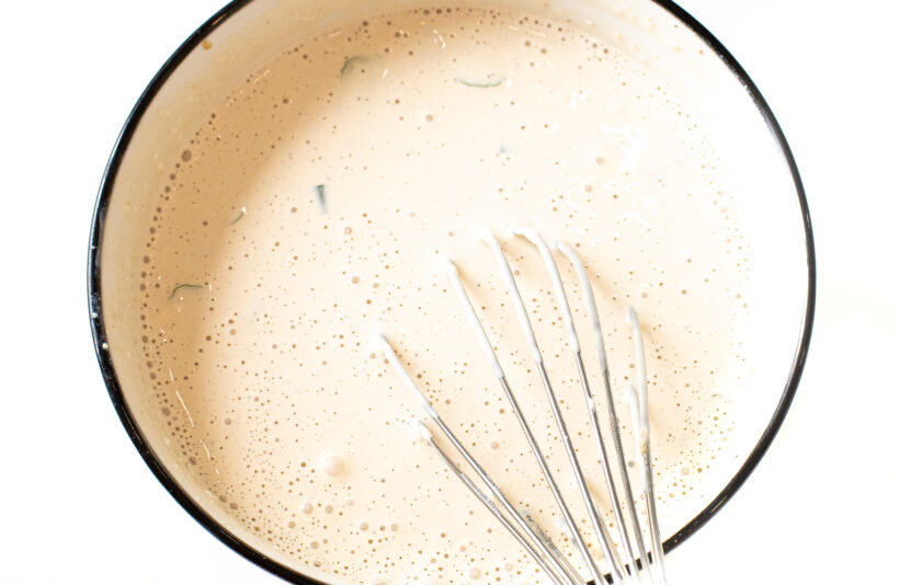 whisking ingredients for blue cheese dressing