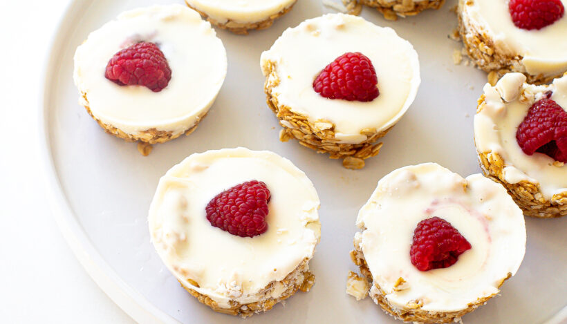 White chocolate oat cups served on a white plate.