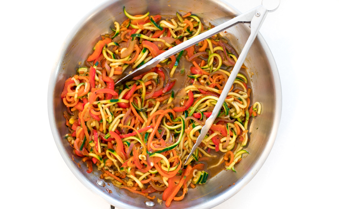 overhead shot of spiralized veggies tossed in an asian sauce